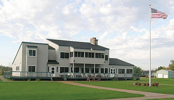 The backside of a shooting range building.